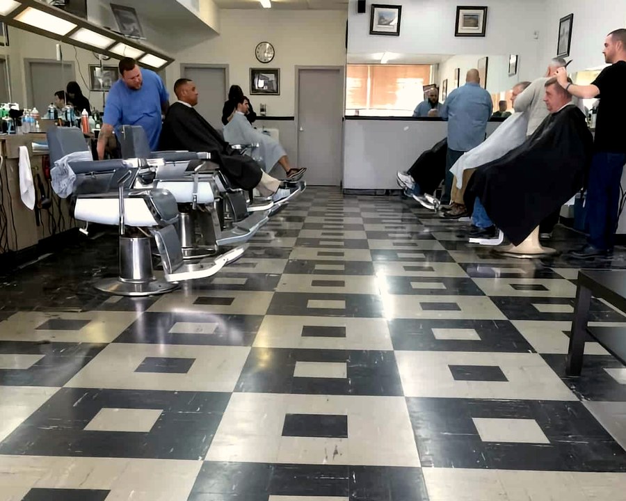 Barbers working with clients inside Mill Creek Barbershop